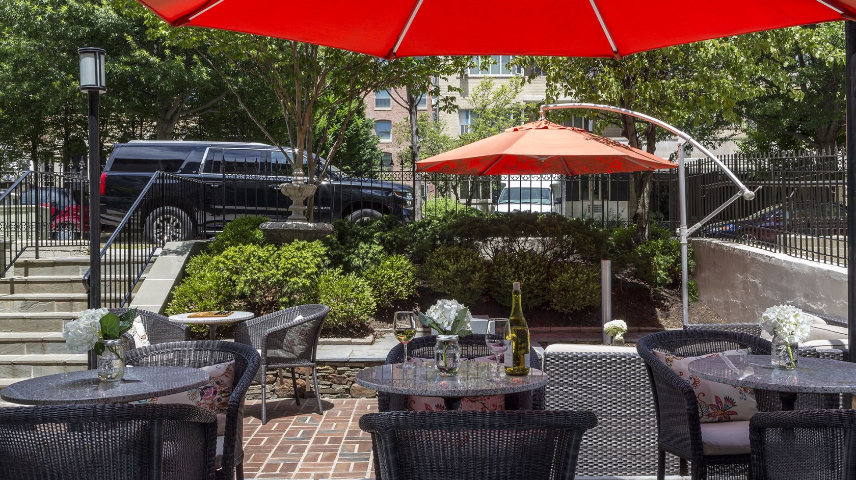 Complimentary wine hour on the shaded patio at The Normandy Hotel in Dupont Circle